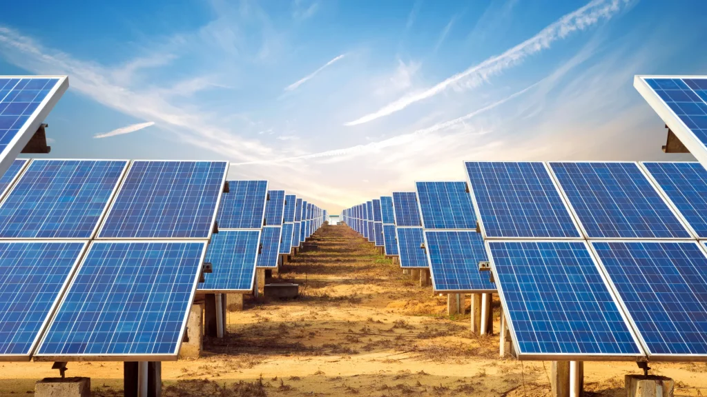 Ground-mounted rows of highest wattage solar panels less than 65 inches long under clear skies for maximum energy capture.